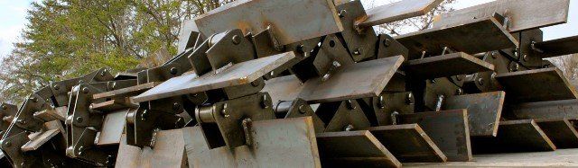 A bunch of metal pieces are stacked on top of each other.