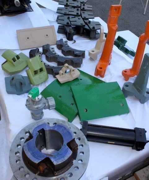 A table with a lot of different pieces of metal on it