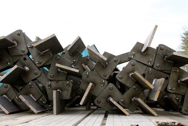 A bunch of metal pieces are stacked on top of each other