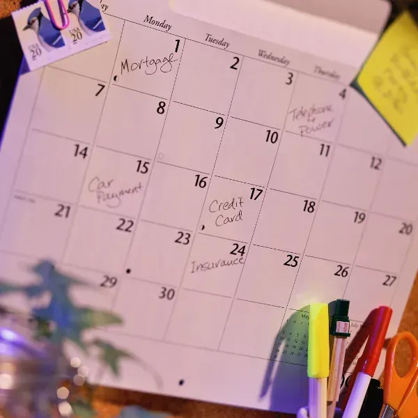 An image of a calendar with payment dates marked.