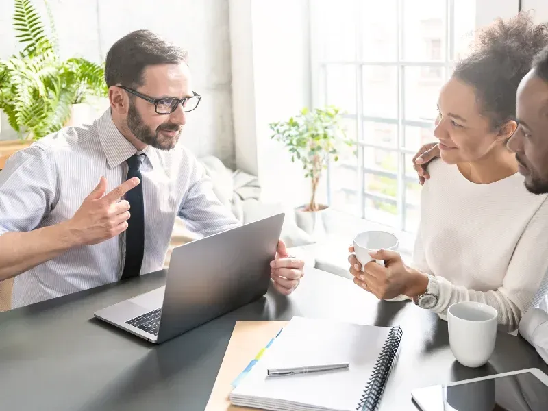 An image showing a family in Greenville, SC discussing life insurance options with an agent.