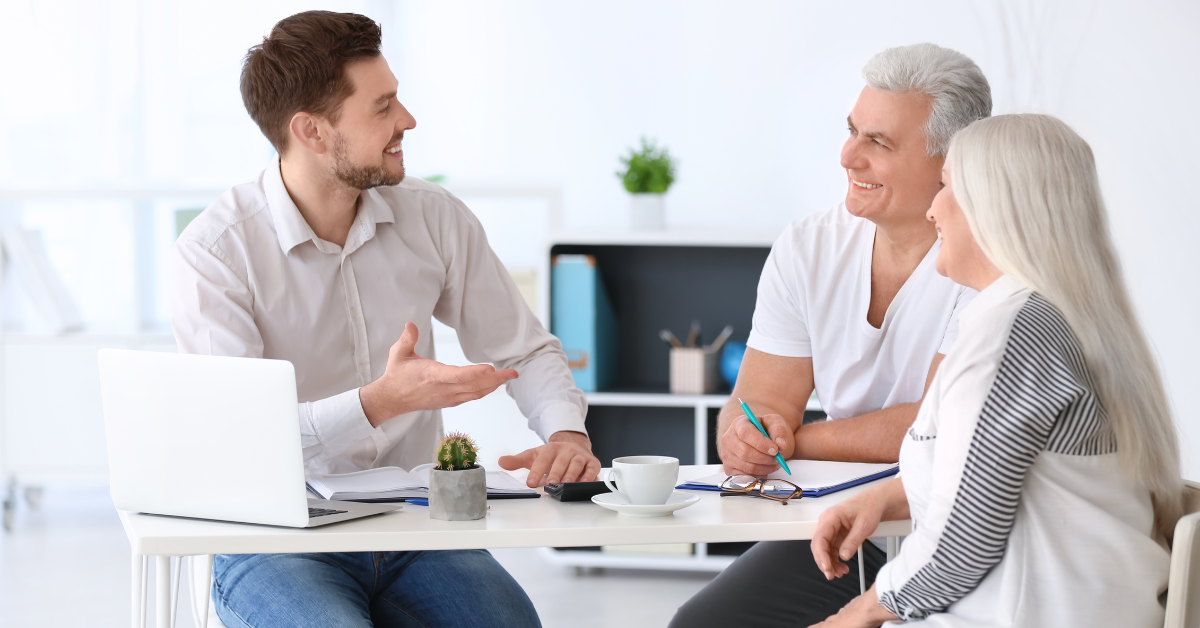 An image showing senior citizens discussing final expense life insurance in Spartanburg.