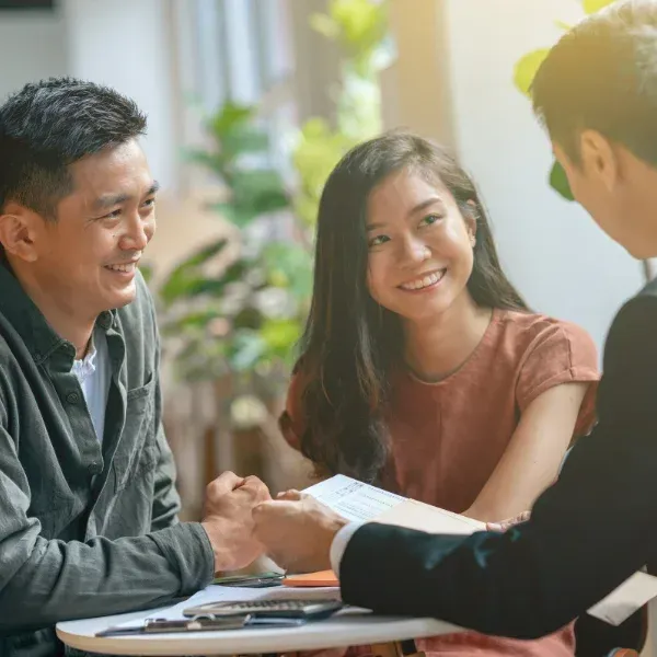 An image showing a couple discussing universal life insurance.