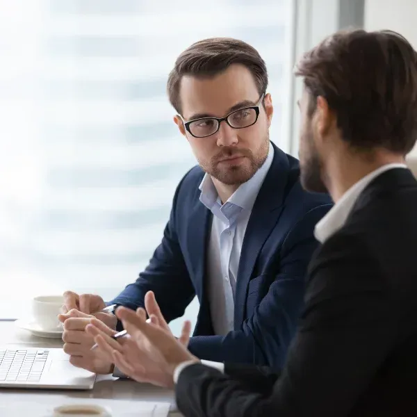 An image showing young adults discussing life insurance options.