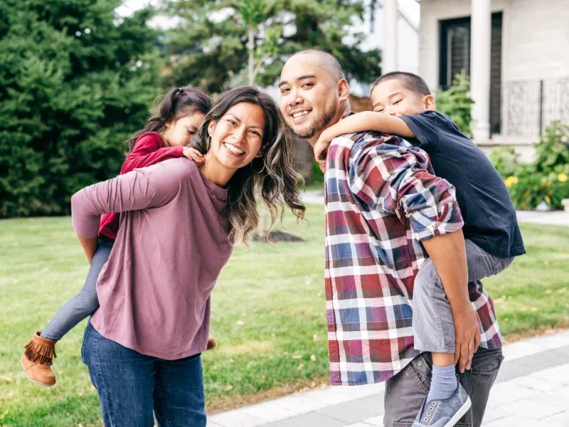 An image showing a family who will benefit from whole life insurance and its lifelong protection.