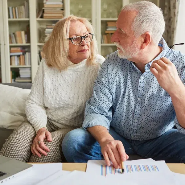 An image showing retirees reviewing life insurance plans in Spartanburg, SC.