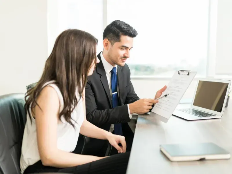 An image showing a single individual reviewing term life insurance options.