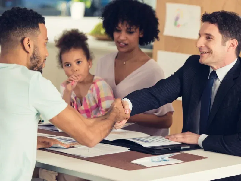 An image showing a family discussing term life insurance options with an advisor.