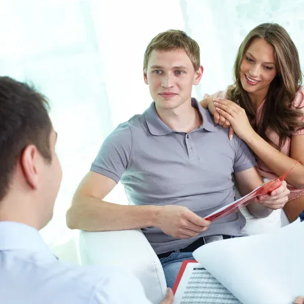 An image showing young adults discussing affordable life insurance options in Spartanburg, SC.
