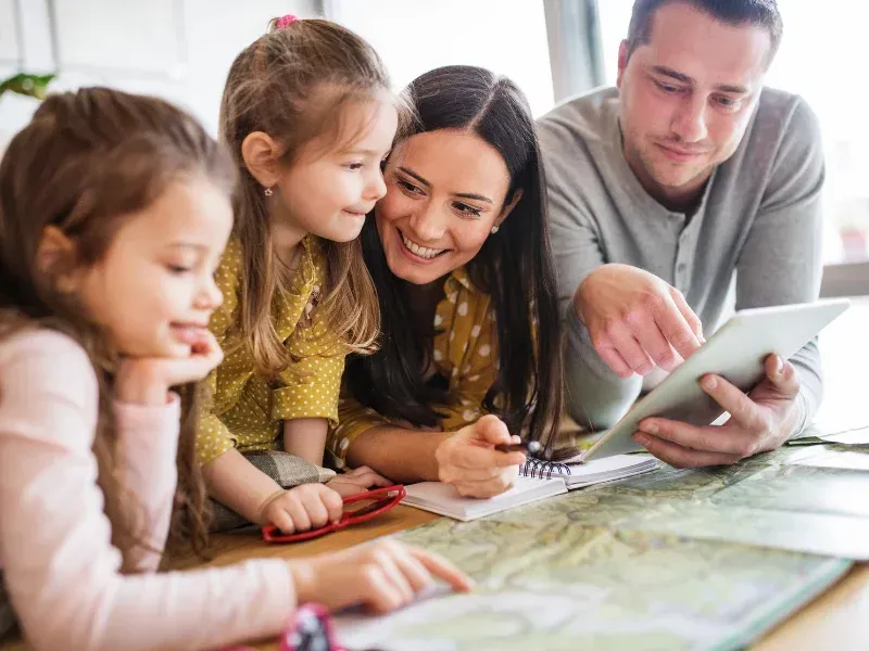 An image showing a young family with children.
