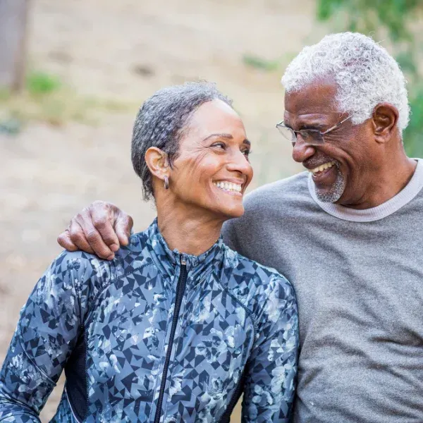 An image showing retirees discussing life insurance plans.