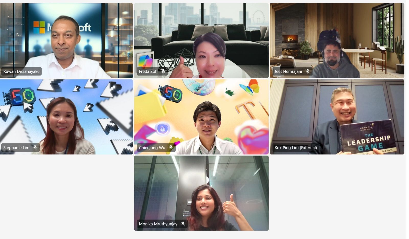 Group video call with seven participants, each showing different virtual backgrounds and gesturing.