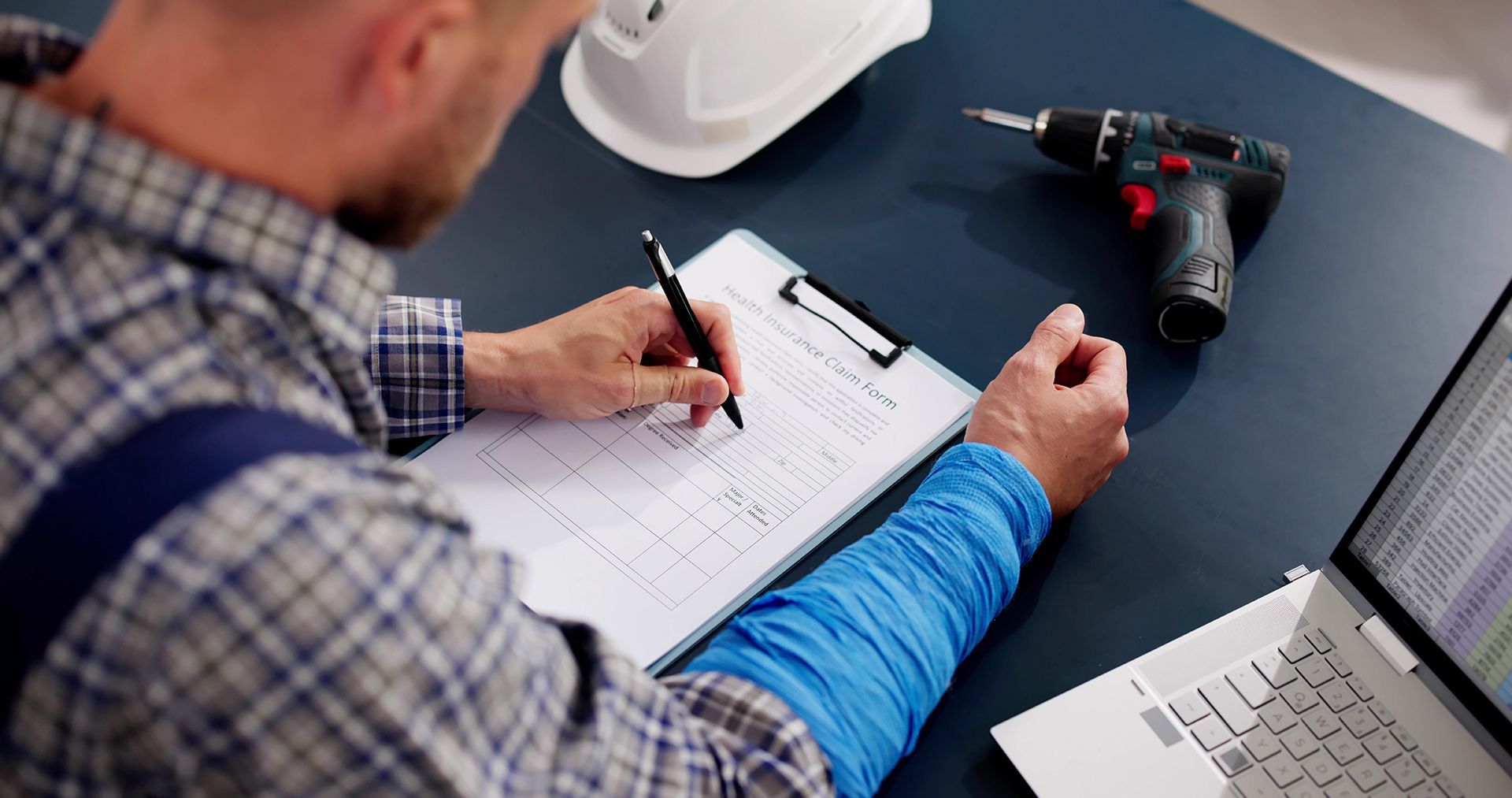 Worker Signing Health Insurance Form