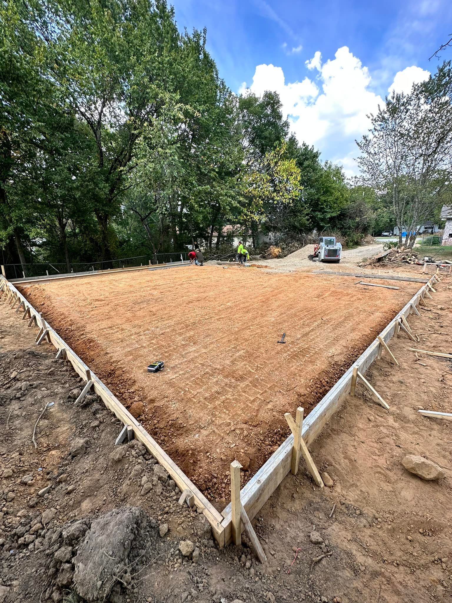 A large pile of dirt is sitting on top of a dirt field.