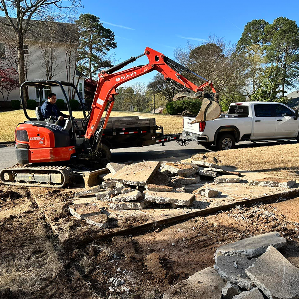 A house with a covered porch and a concrete walkway