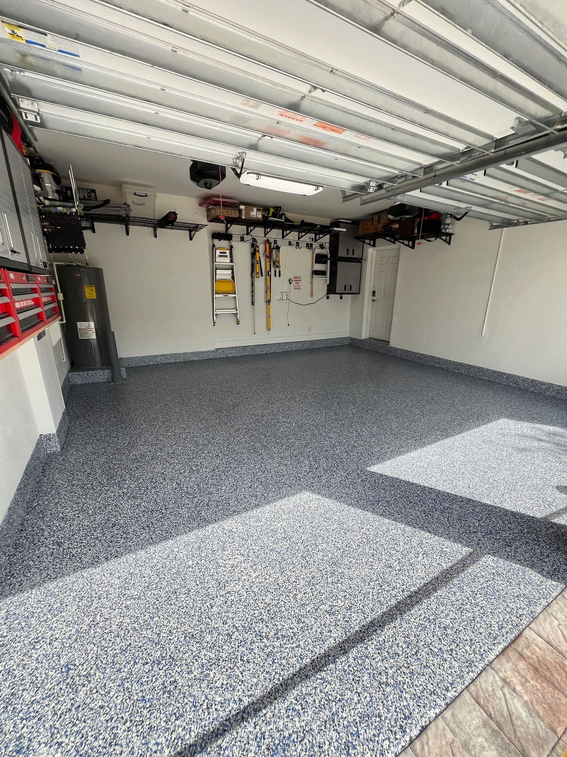 Concrete is being poured into a concrete foundation at a construction site.