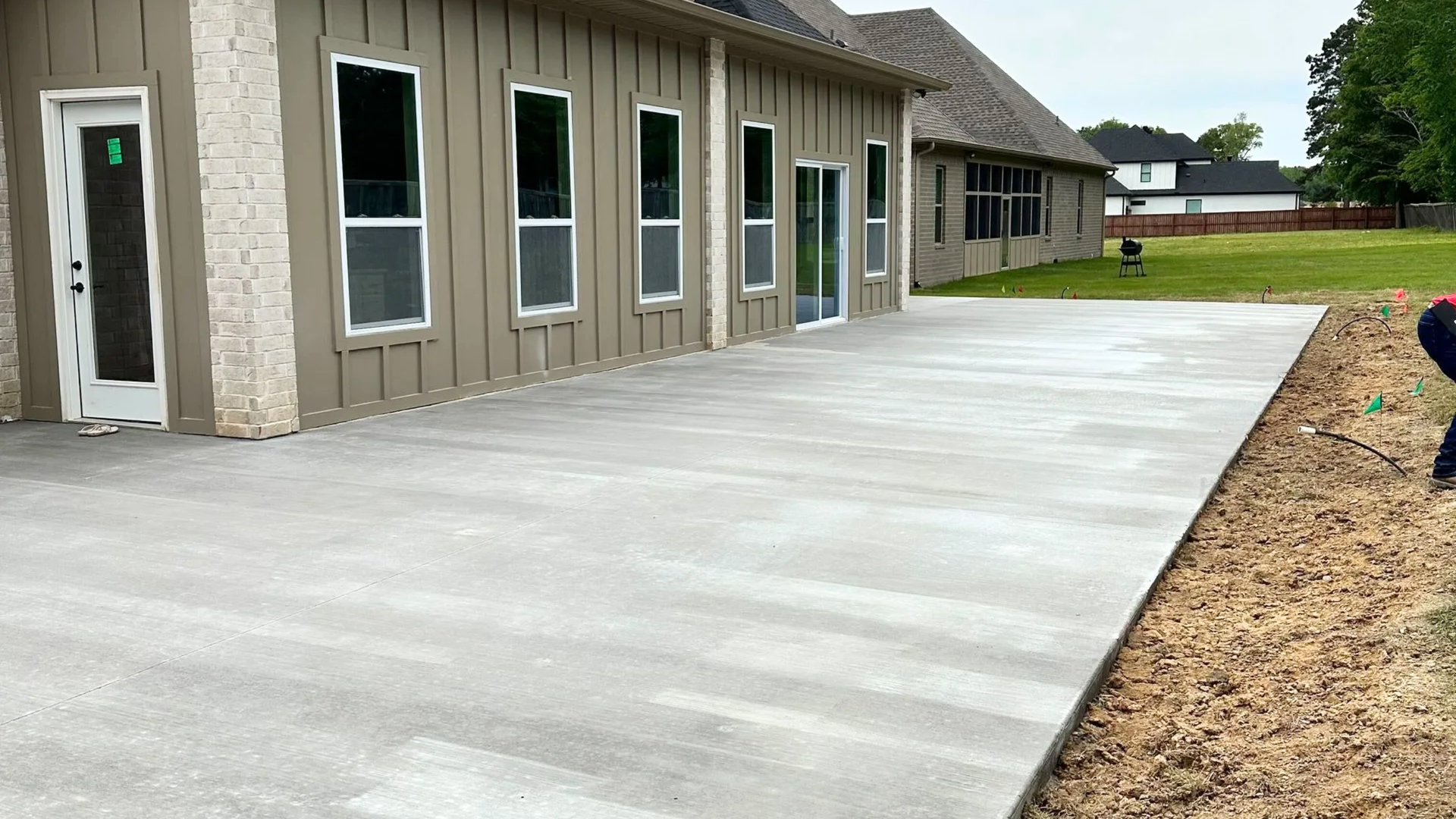 Concrete patio installation for a residential outdoor living space in Central Arkansas