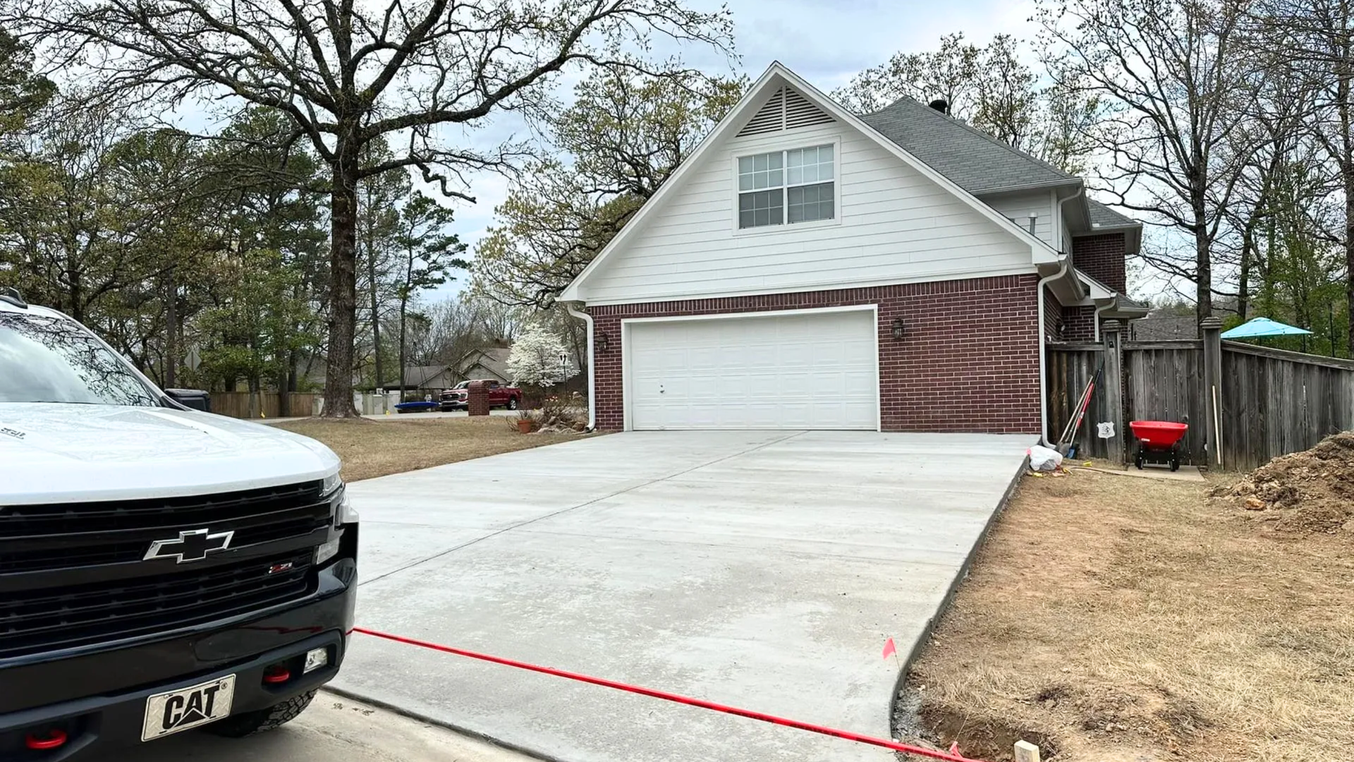 Residential concrete driveway installation in Central Arkansas showing proper grading and finishing