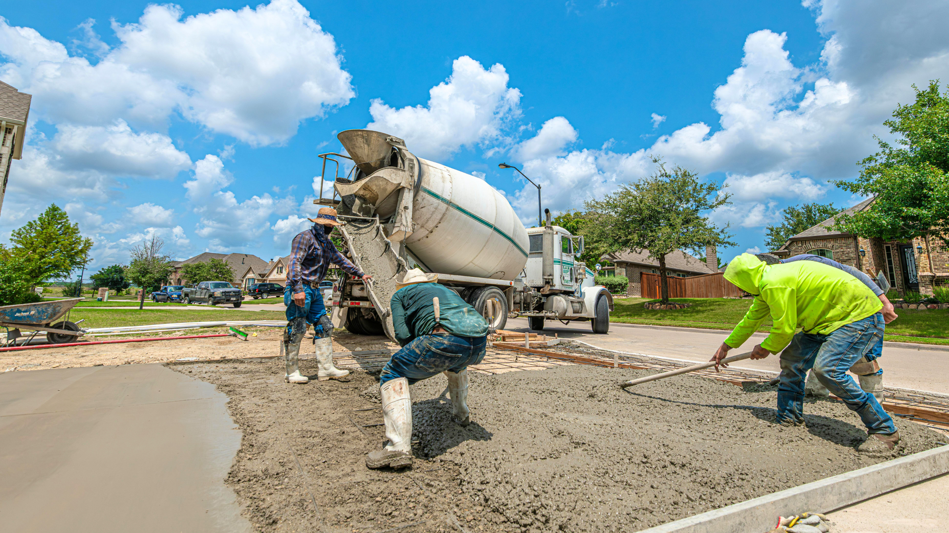 Concrete driveway with visible cracks and surface damage showing signs that may require repair or full replacement