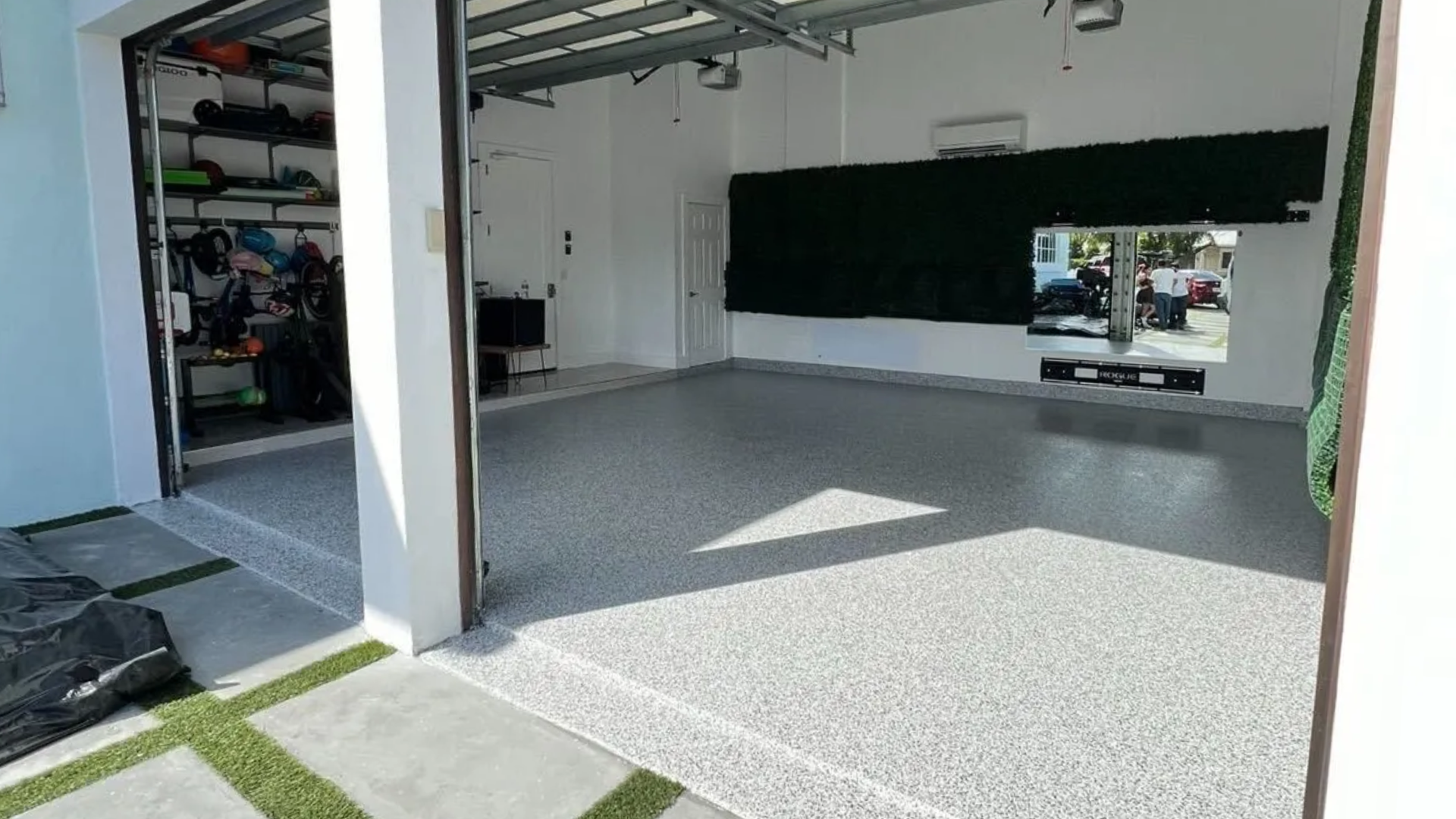 Finished epoxy garage floor coating with smooth durable surface inside residential garage