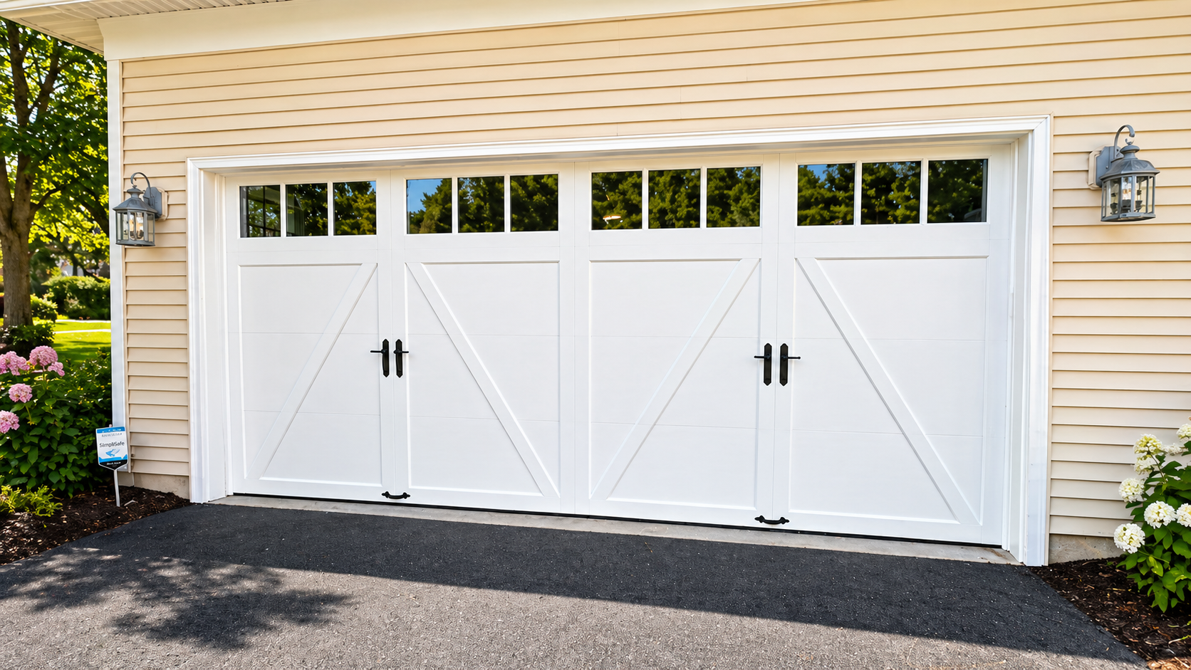 Garage wall with mounted garage door opener hardware, tracks, and a car roof in the foreground