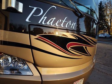 A Phaeton Bus is Parked in a Parking Lot