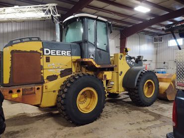 A Yellow and Black Deere Wheel Loader 