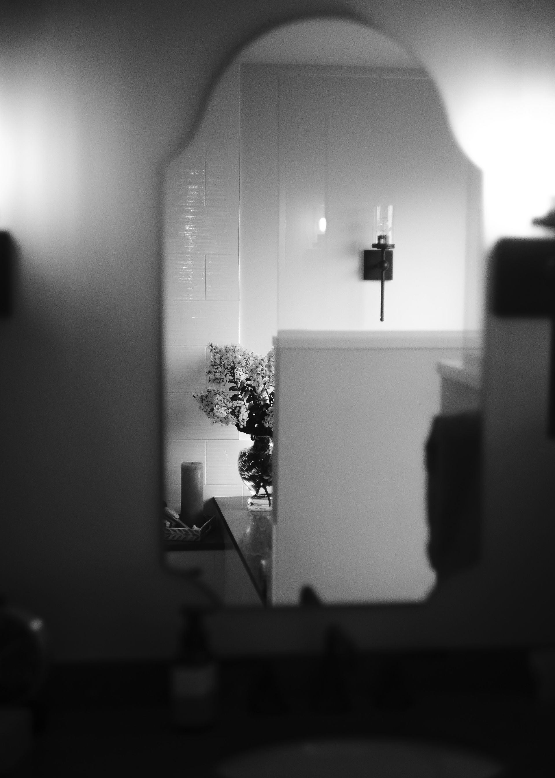 Delray Project - black and white photo of a mirror in a room