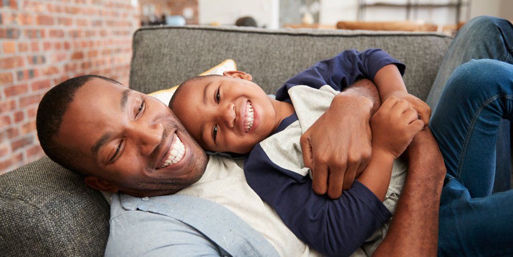 Father and Son Laughing | GO Property Management