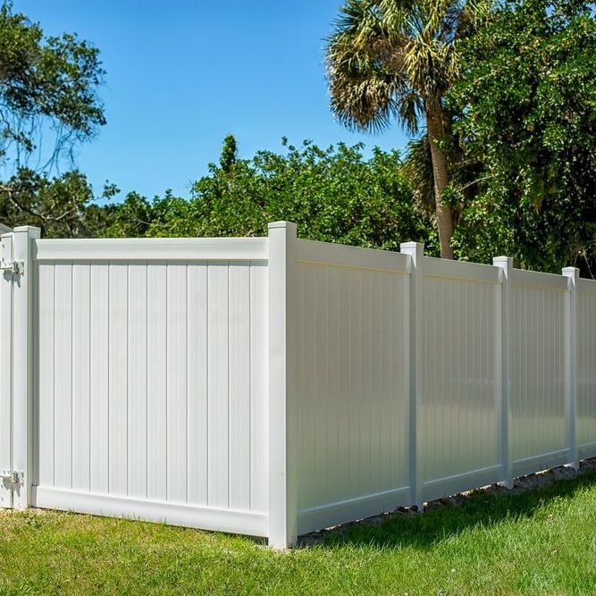A white fence with tree on it