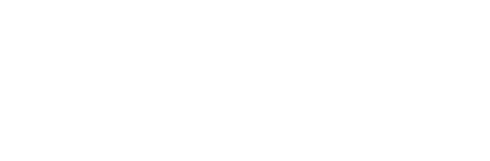 A person sits in a meditation pose on a blue mat, surrounded by a serene forest of tall, pine-like trees.