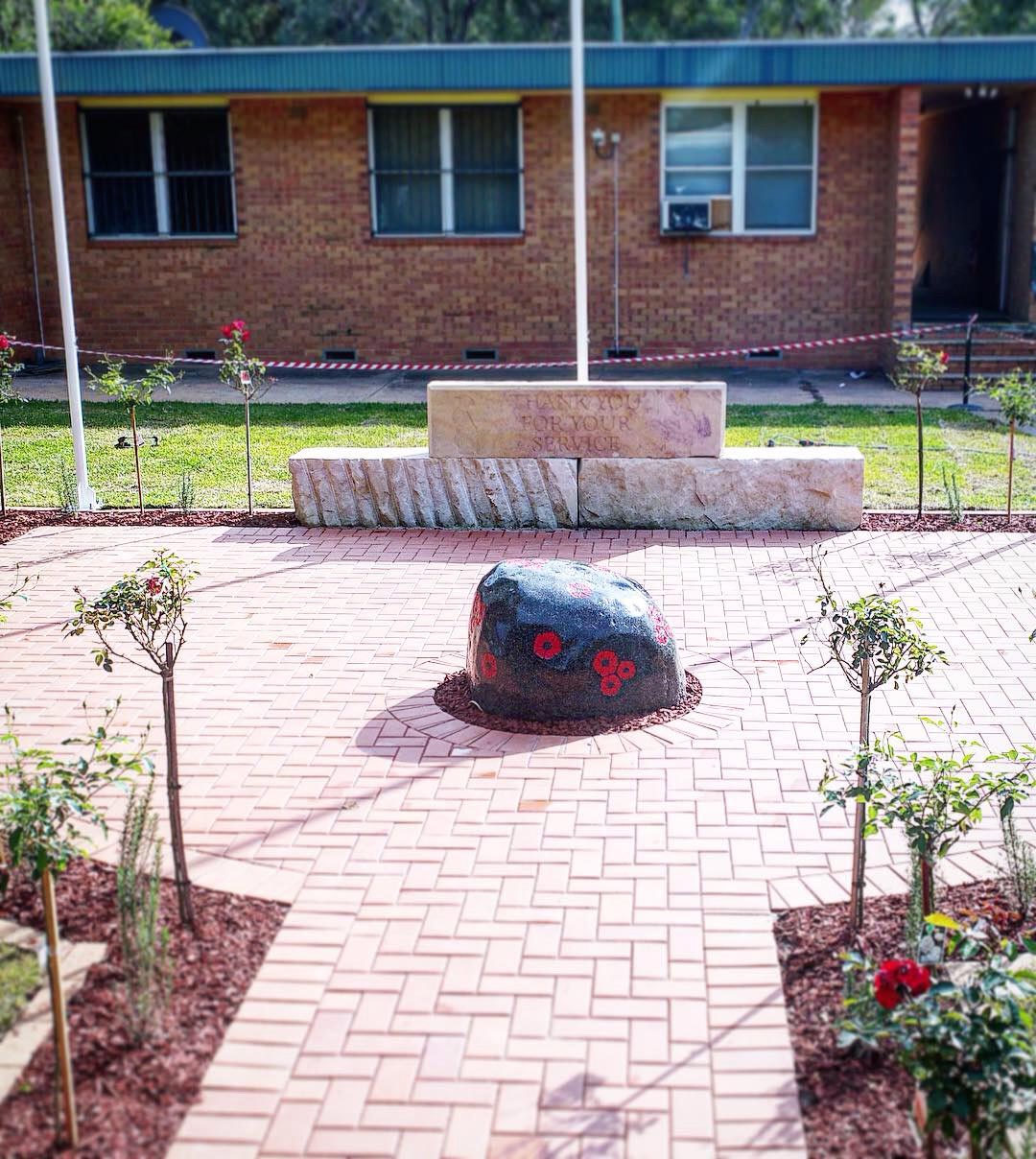 stone in the middle of a park