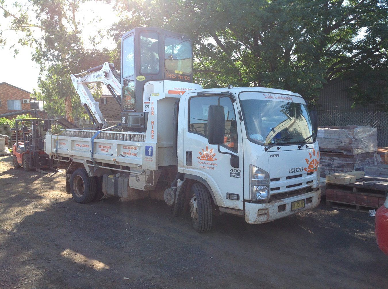 white truck carrying machine