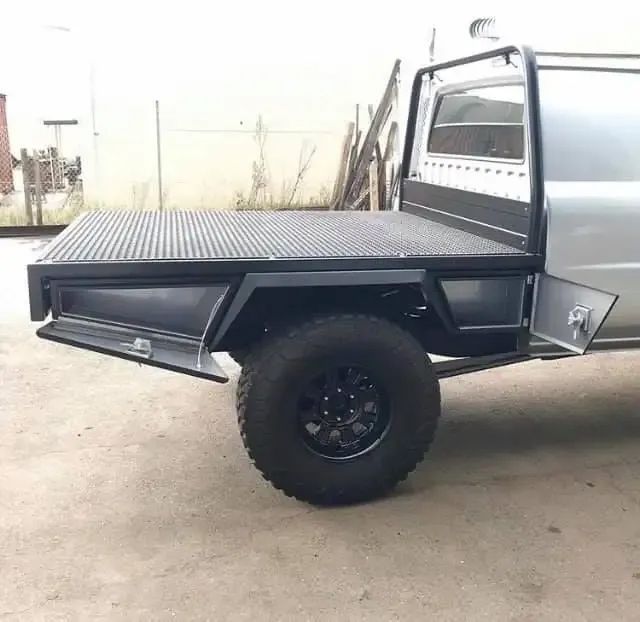 A Silver Truck With A Flat Bed Is Parked In A Parking Lot — Hunter Powder & Paints In Cessnock, NSW