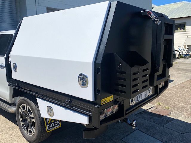 A White Truck With A Black Canopy Is Parked On The Side Of The Road — Hunter Powder & Paints In Rutherford, NSW