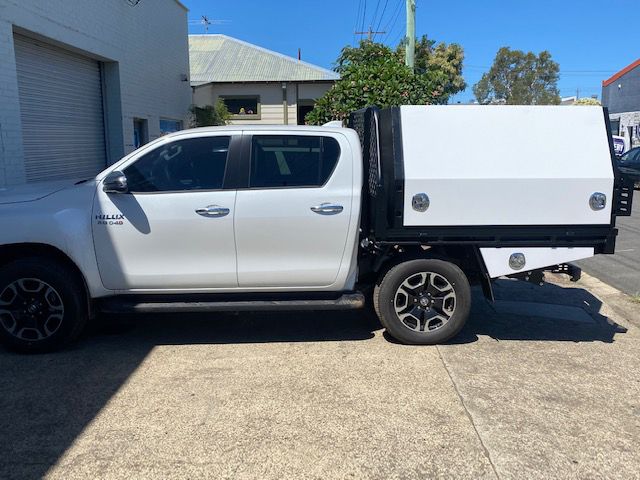 A White Truck With A Canopy Is Parked On The Side Of The Road — Hunter Powder & Paints In Rutherford, NSW