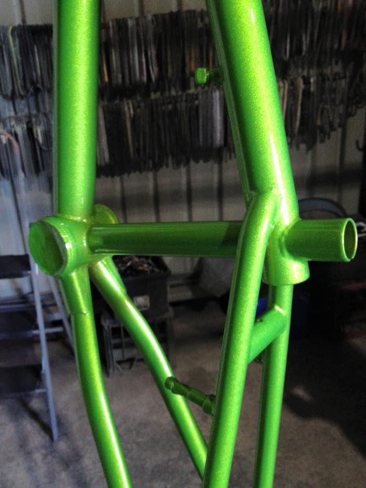 A Green Bicycle Frame Is Sitting On The Floor In A Garage — Hunter Powder & Paints In Scone, NSW