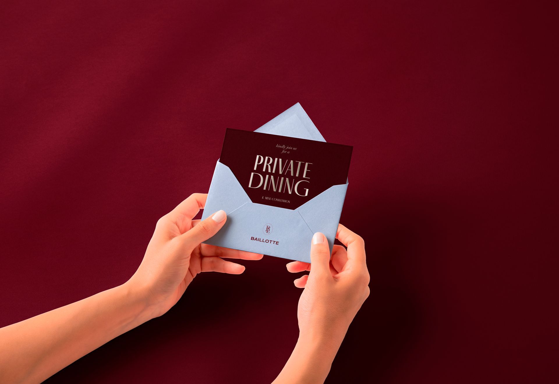 Hands holding a light blue envelope with 