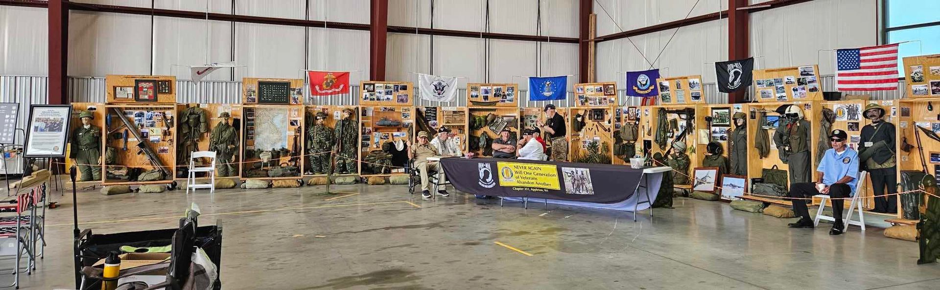 A large warehouse filled with lots of boxes and flags.