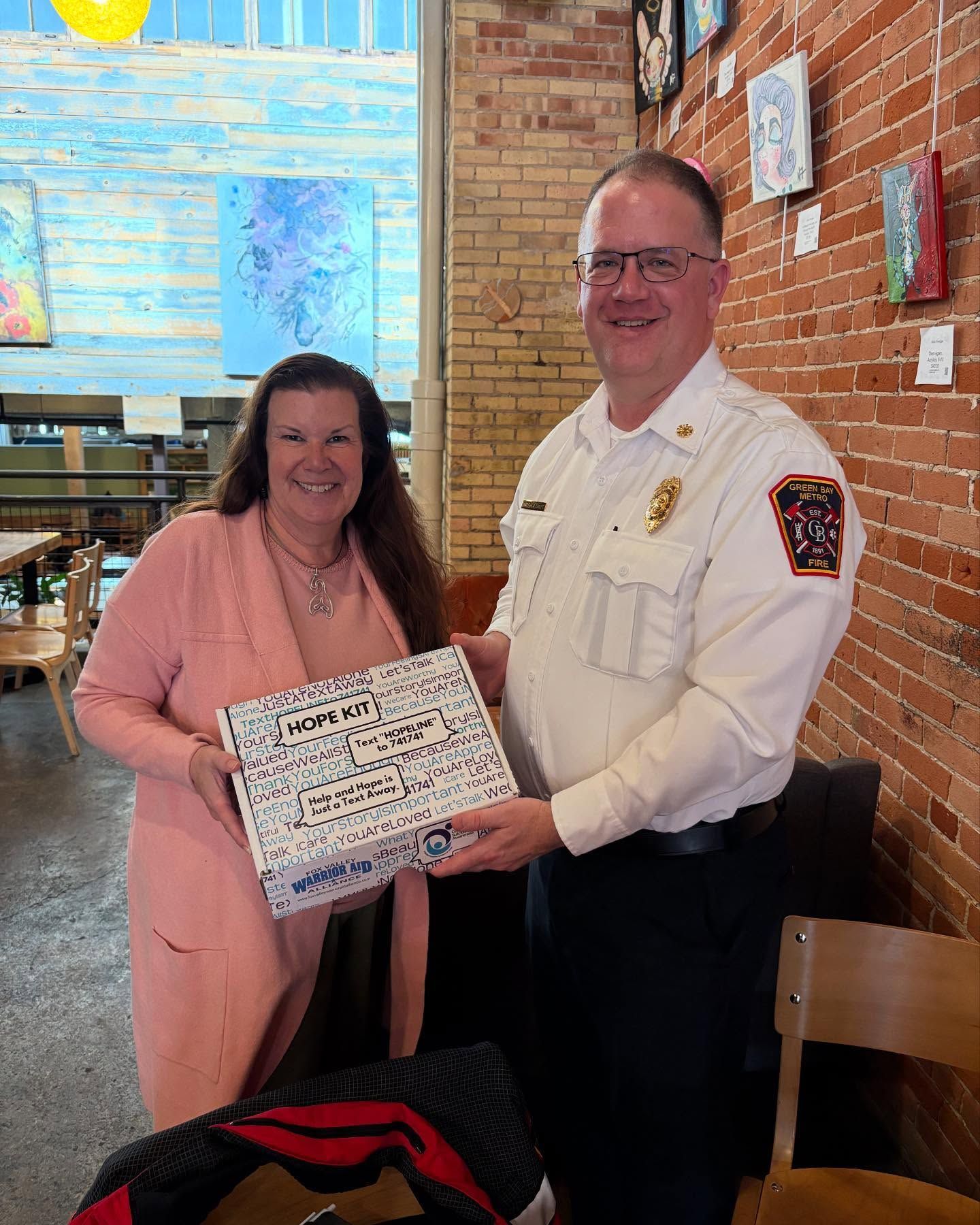 Diverse group of people with hands in a circle, teamwork concept.