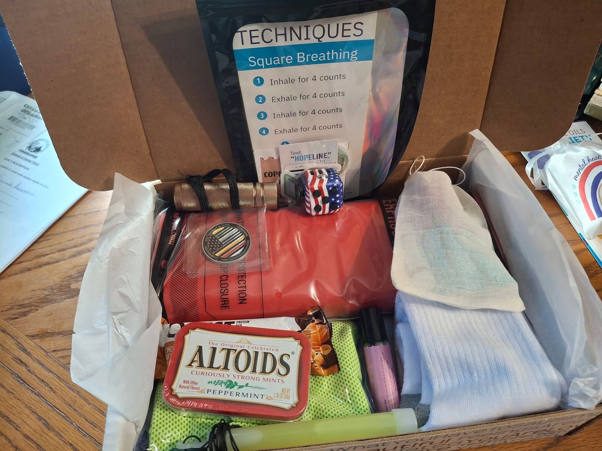 Diverse group of people with hands in a circle, teamwork concept.