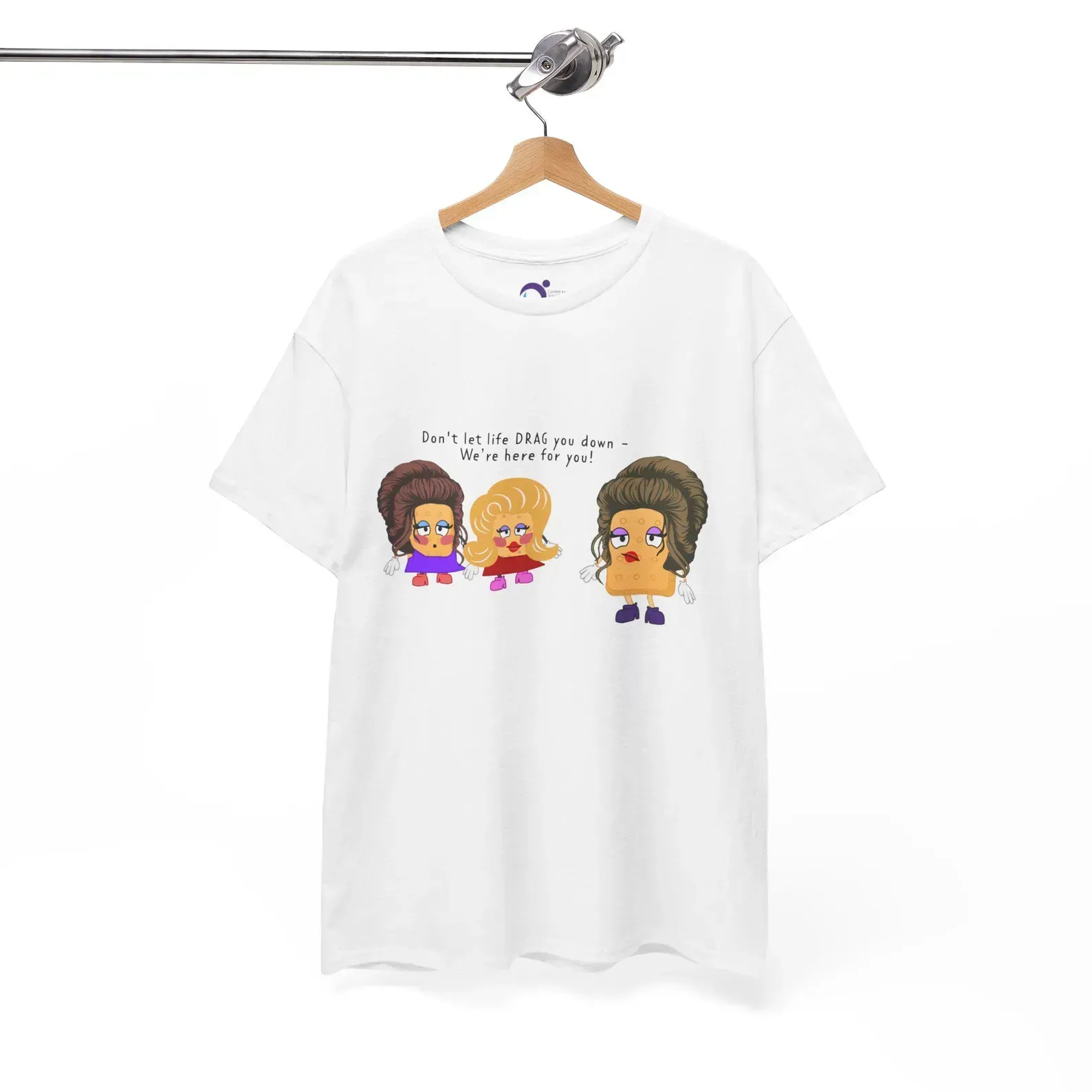 A white t-shirt with three cartoon characters on it is hanging on a hanger.