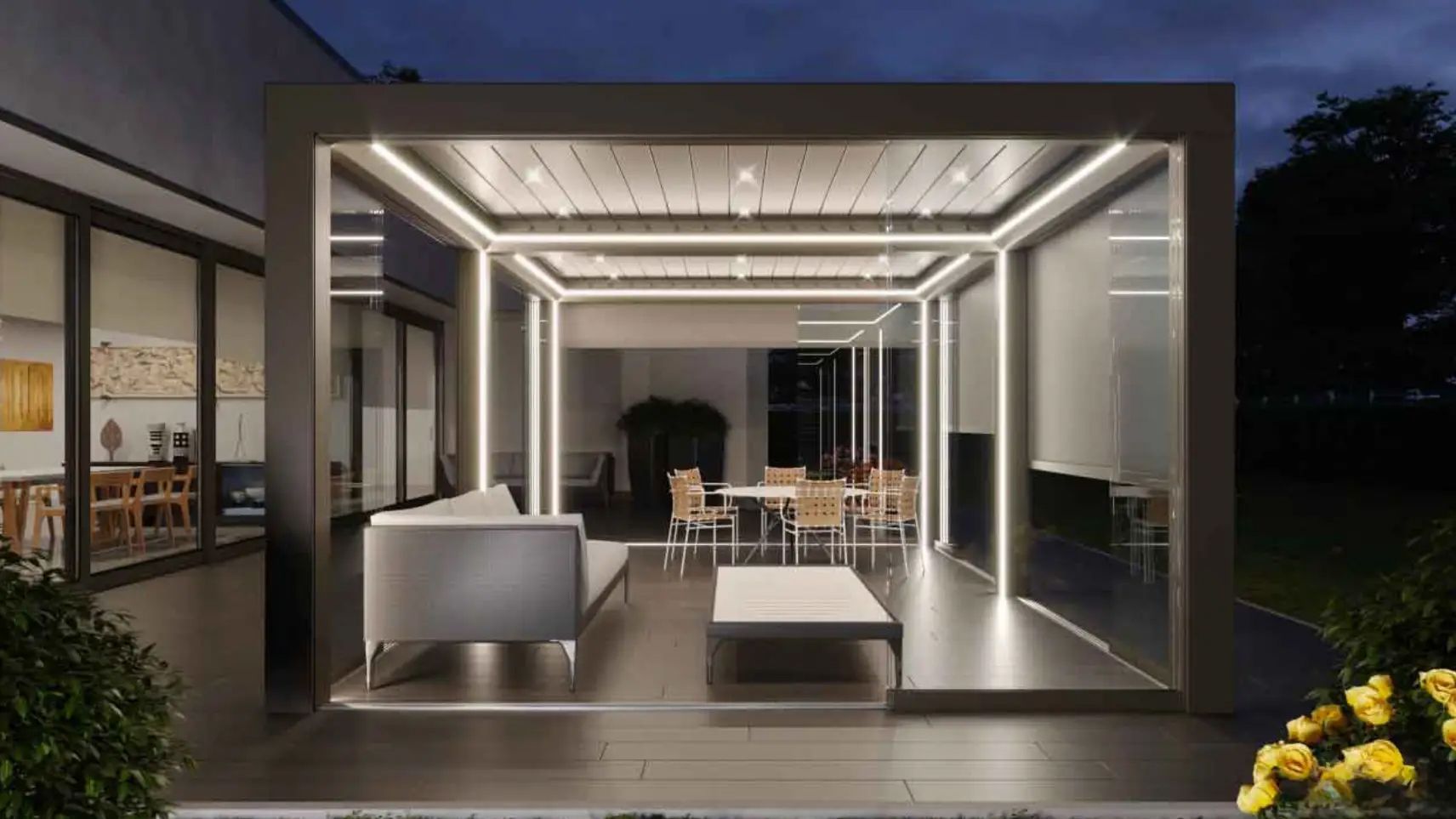 Un soggiorno con divano, tavolo e sedie sotto un pergolato.