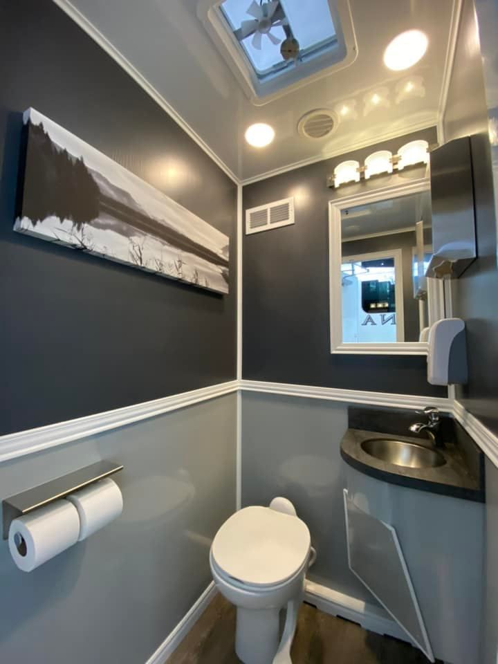 Interior view of a modern and elegant bathroom, showcasing luxury restroom trailer rentals.