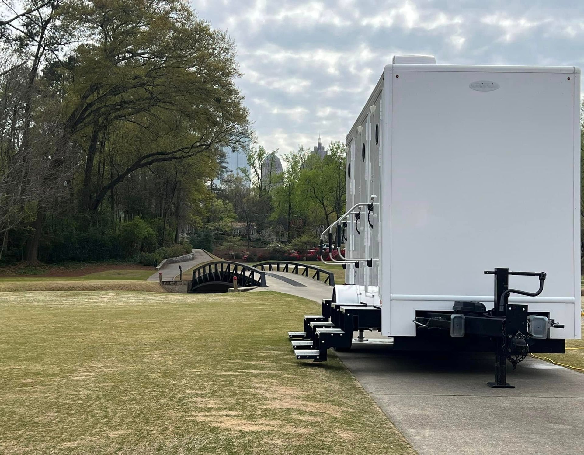 Modern bathroom with a toilet and sink, showcasing luxury restroom trailer rentals in Atlanta by 
