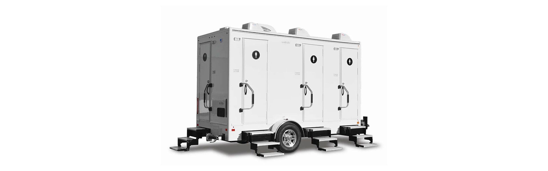 White portable restroom trailer with three individual doors and fold-out steps on each entrance.