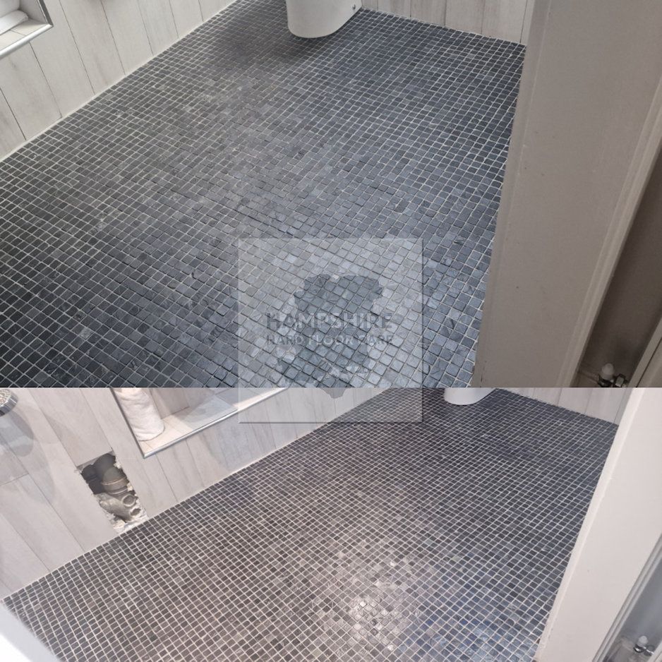 Machine agitation lifting ingrained dirt from textured slate surface