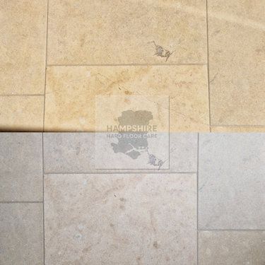 Limestone tiles with restored grout lines after deep cleaning
