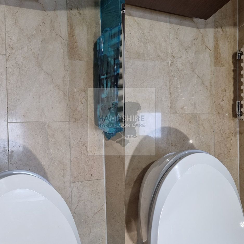 Marble bathroom floor in Hampshire restored to a mirror-like shine