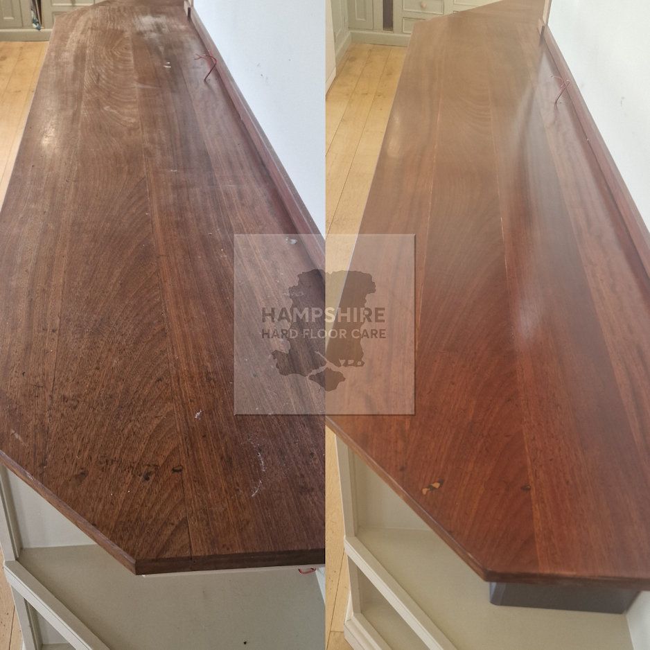Wood kitchen worktop undergoing sanding to repair water damage and stains